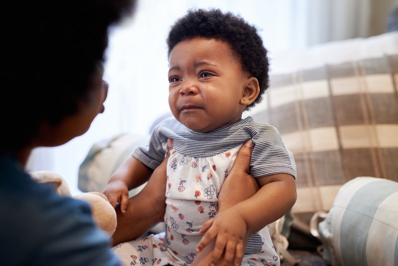 Baby sieht unglücklich aus