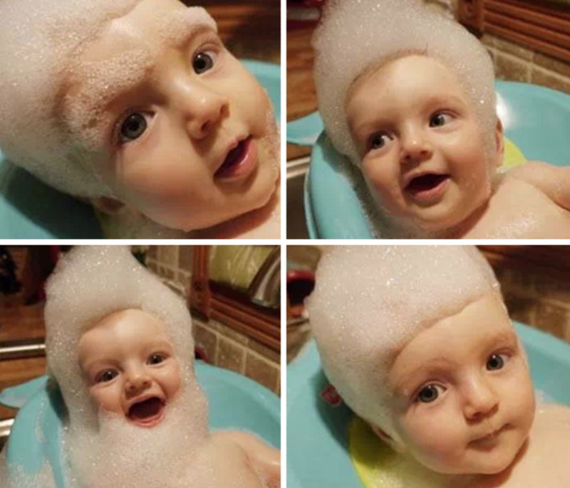 Ein Vater, der sein Baby baden muss und ihm Frisuren mit dem Schaum macht