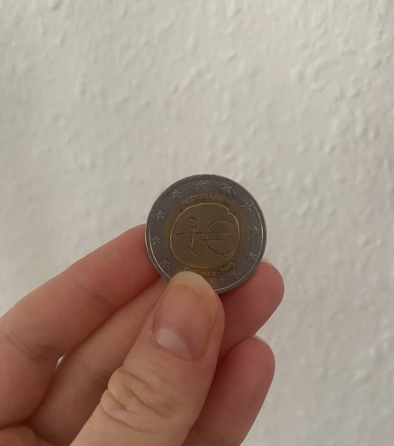 Was bedeutet die Münze mit so einem Strichmännchen?